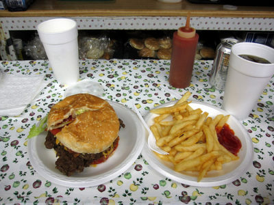 a hamburger and fries on a table