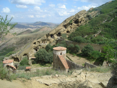 a stone building in a valley