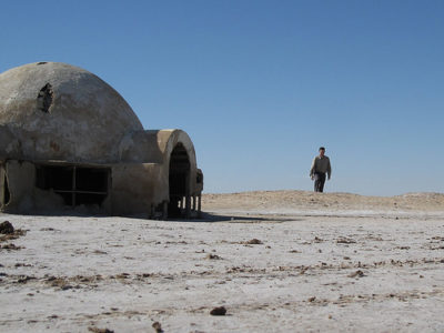 a man walking in the desert