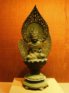 a statue of a person sitting on a lotus flower