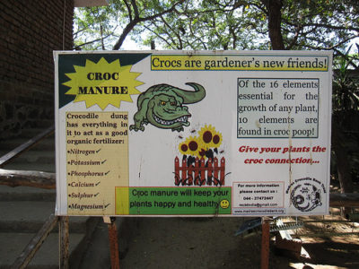 a sign with a crocodile on it