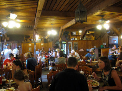 a group of people eating at a restaurant