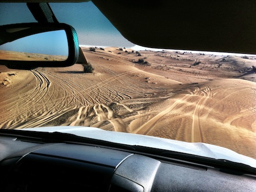 a view from a car window of a desert