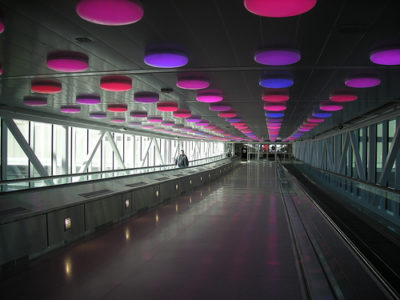 a walkway with colorful lights