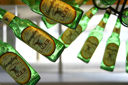 green bottles of beer from a ceiling