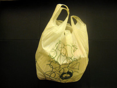 a plastic bag with green designs