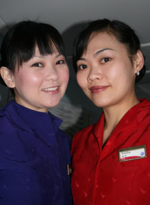 a pair of women wearing matching outfits