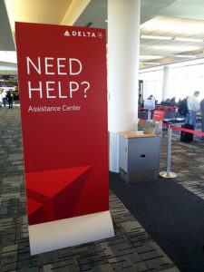 a red sign in an airport