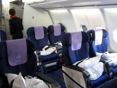 a plane seats with pillows