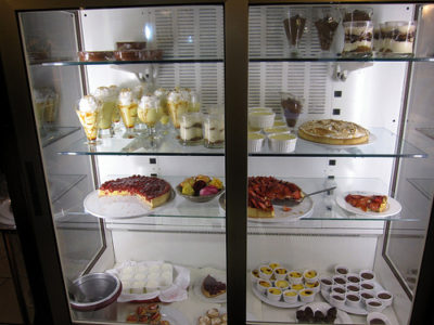 a display case with desserts and desserts