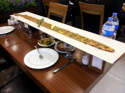 a long pizza on a table