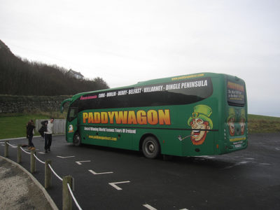 a green bus with a cartoon character on it