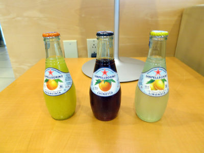 a group of bottles of soda on a table