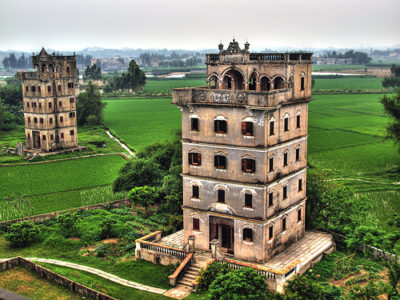 a two towers in a green field