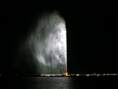 a water fountain with a bright light coming out of it