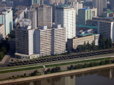 a large building next to a river