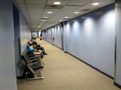 people sitting in a hallway