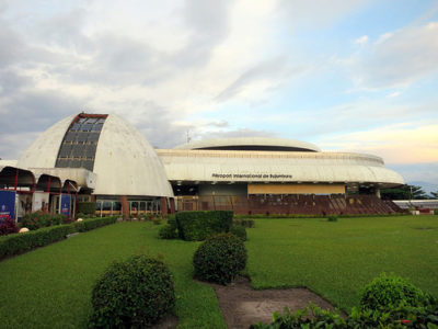 a building with a dome and a green lawn