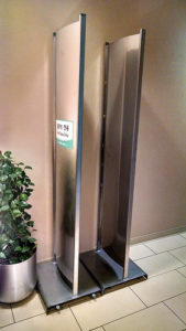 a metal door with a green sign