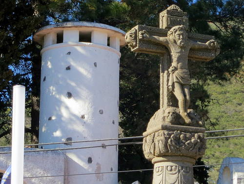 a statue of a man on a cross