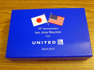 a blue book with white text and flags on it