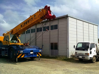 a crane lifting a building