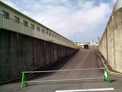 a road with a barrier on the side