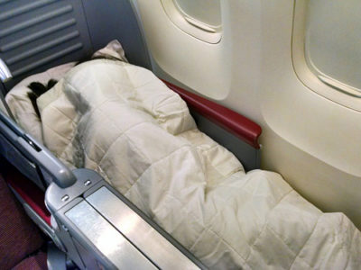 a person sleeping in a plane