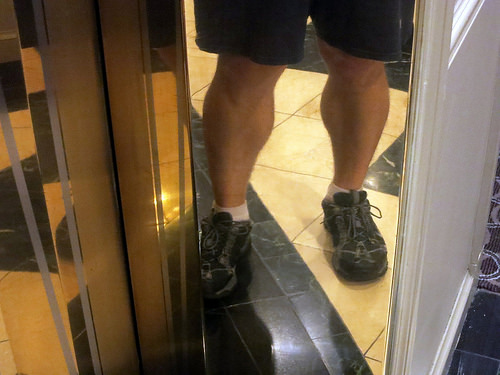 a person's legs in a mirror