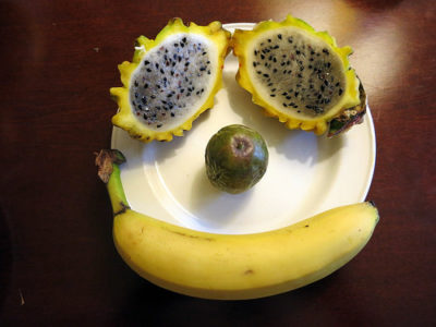 a banana and fruit on a plate