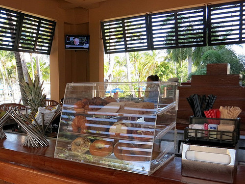 a display case of donuts and other pastries