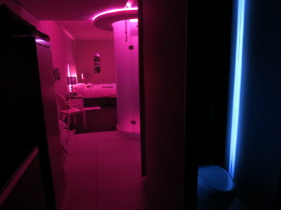 a room with pink lights