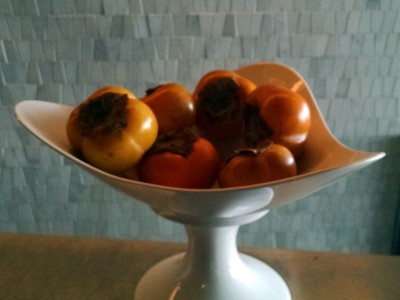 a bowl of persimmons