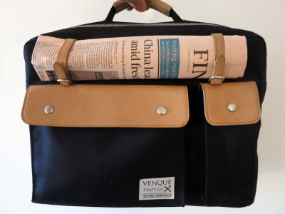 a bag with a newspaper on it