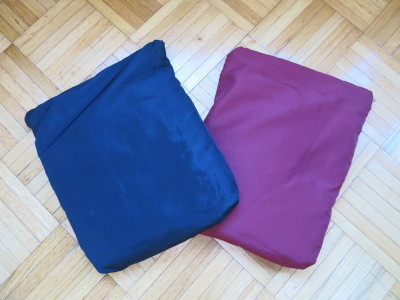 two pillows on a wood floor
