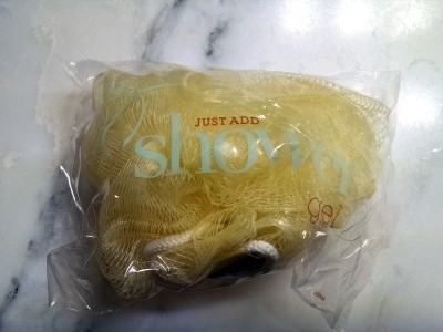 a bag of yellow bath sponge
