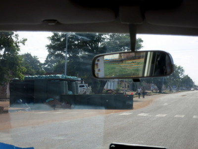 a rear view mirror of a road