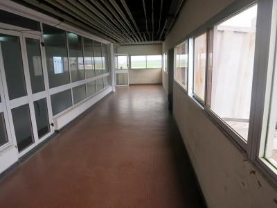 a hallway with glass windows
