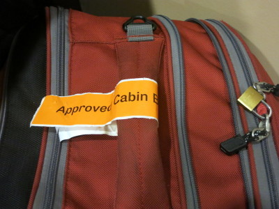a luggage bag with a tag