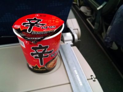 a cup of food on a plane