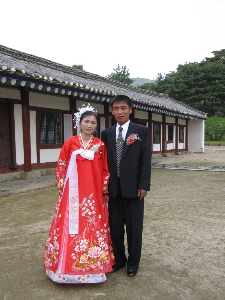 a man and woman in traditional dress